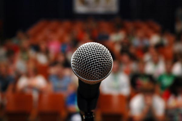 microphone color in focus background audience out of focus