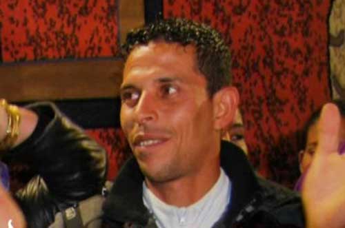 mohamed bouazizi color looking to his right red background