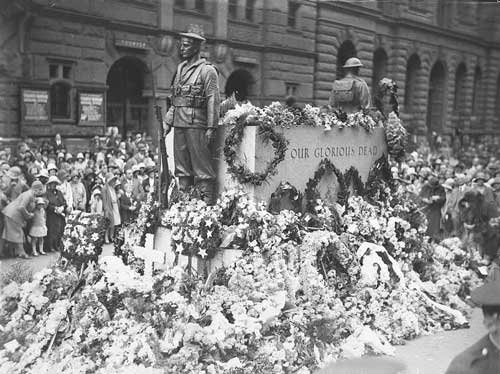 cenotaph monument world war one statues soldiers black and white crowd flowers flags sydney australia