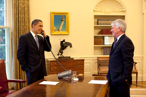 barack obama on telephone gregory craig color standing smiling oval office